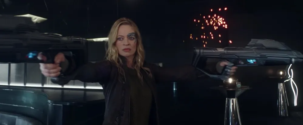 A photo of Seven of Nine holding two phaser rifles