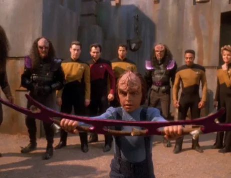 Alexander Rozhenko brandishing a pink-colored bat'leth
