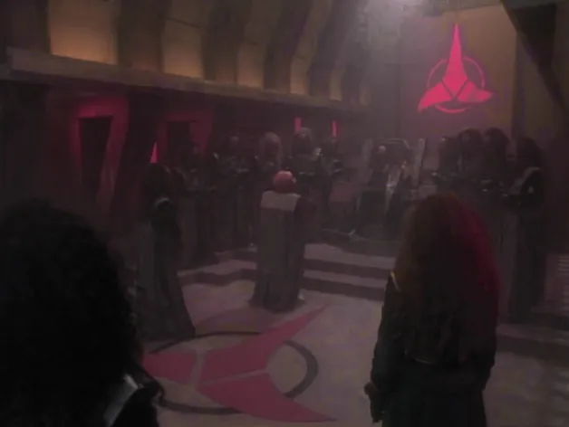 The Klingon High Council chamber, adorned with pink emblems and lighting