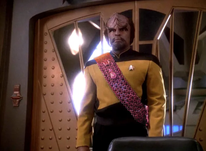 Worf, sporting a pink baldric