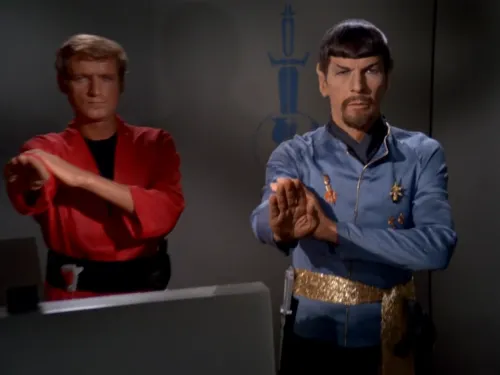 Spock, with a goatee, and a transporter operator performing the Terran Empire salute