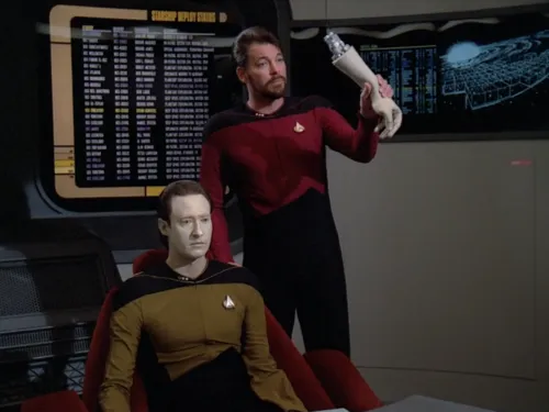 Riker holding up Data's detached arm as an exhibit in a hearing