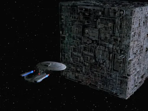 The Enterprise-D being dwarfed by a huge cubical vessel