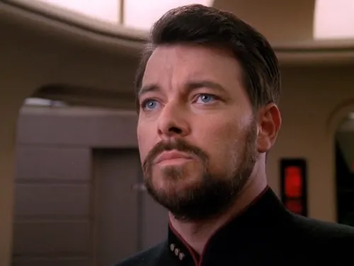 Riker, with a grim look on his face, on the bridge at red alert