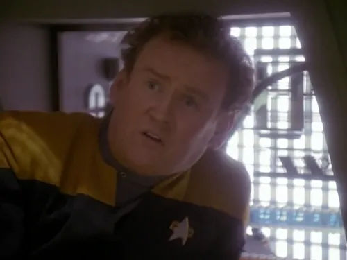 O'Brien in a Jefferies tube looking shocked