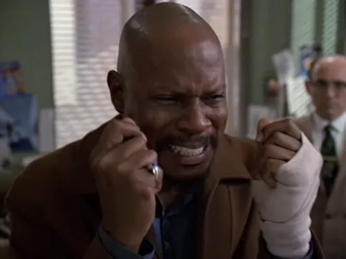 Benny, with fists balled up and teeth gritted, sobbing
