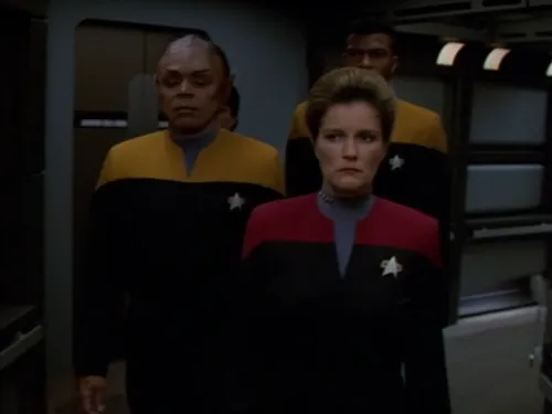 Janeway, looking grim, and two security officers escorting Tuvix to sickbay