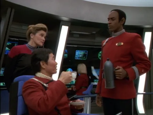 Tuvok serving tea to Sulu on the bridge of the USS Excelsior