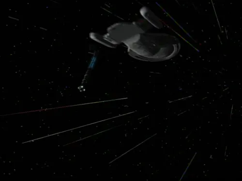 The warp core floating in space behind the USS Voyager