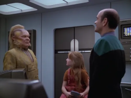 Neelix looking very confused in sickbay where he finds The Doctor and Naomi Wildman