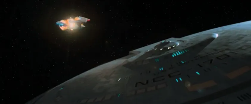 The Enterprise-D saucer section escaping as the stardrive section explodes