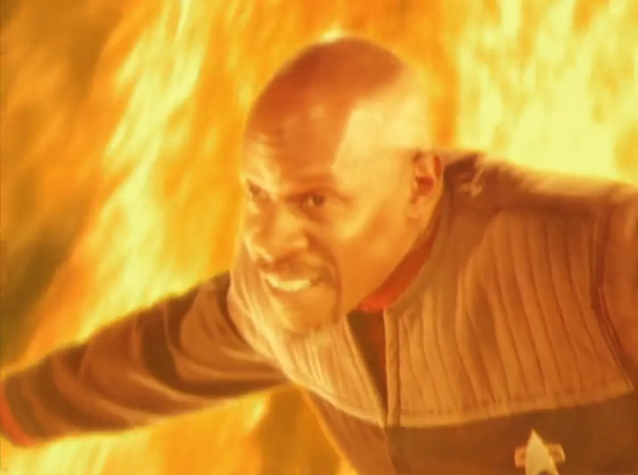 Sisko surrounded by a sea of brilliant flames