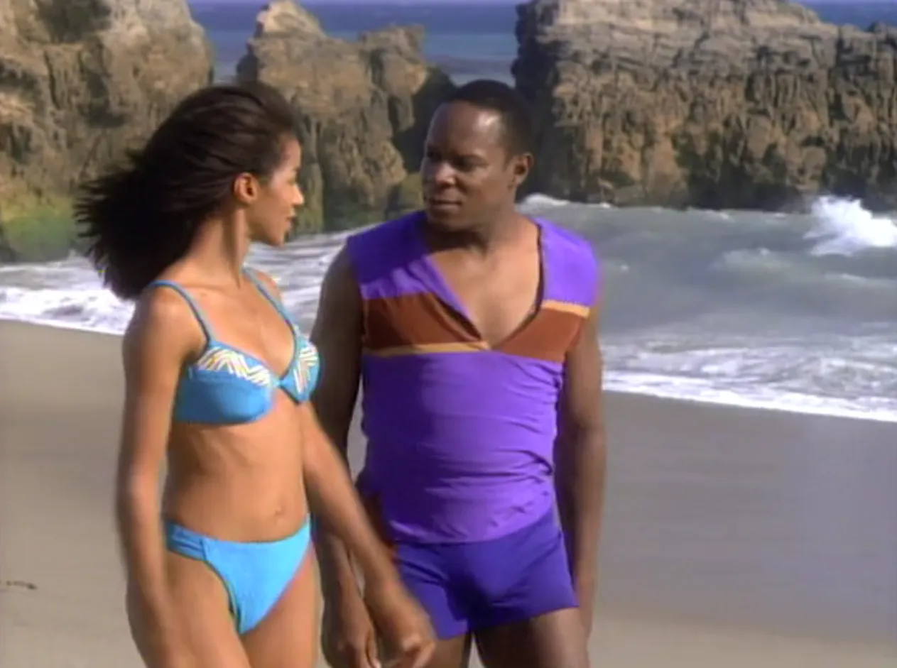 Sisko and Jennifer strolling on a beach