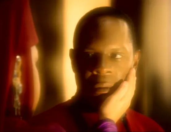 Kai Opaka touching Benjamin Sisko's face