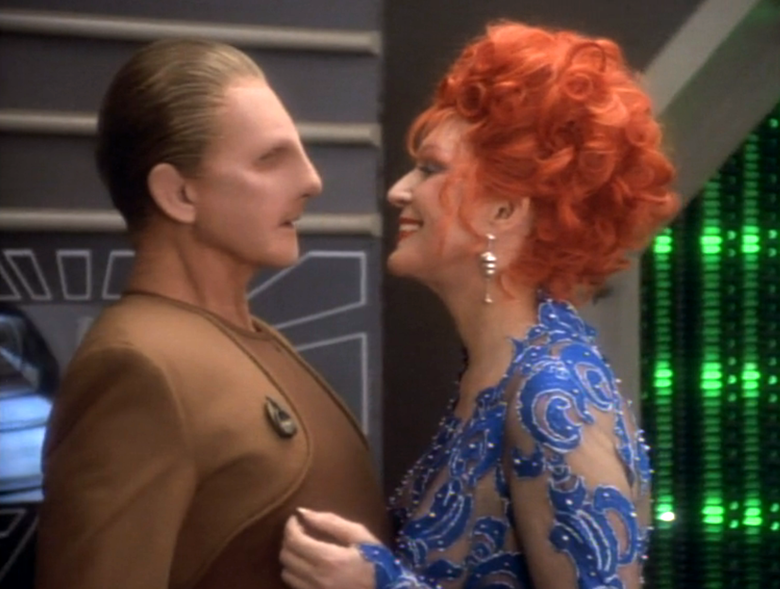 Odo leaning back away from Lwaxana Troi's advances