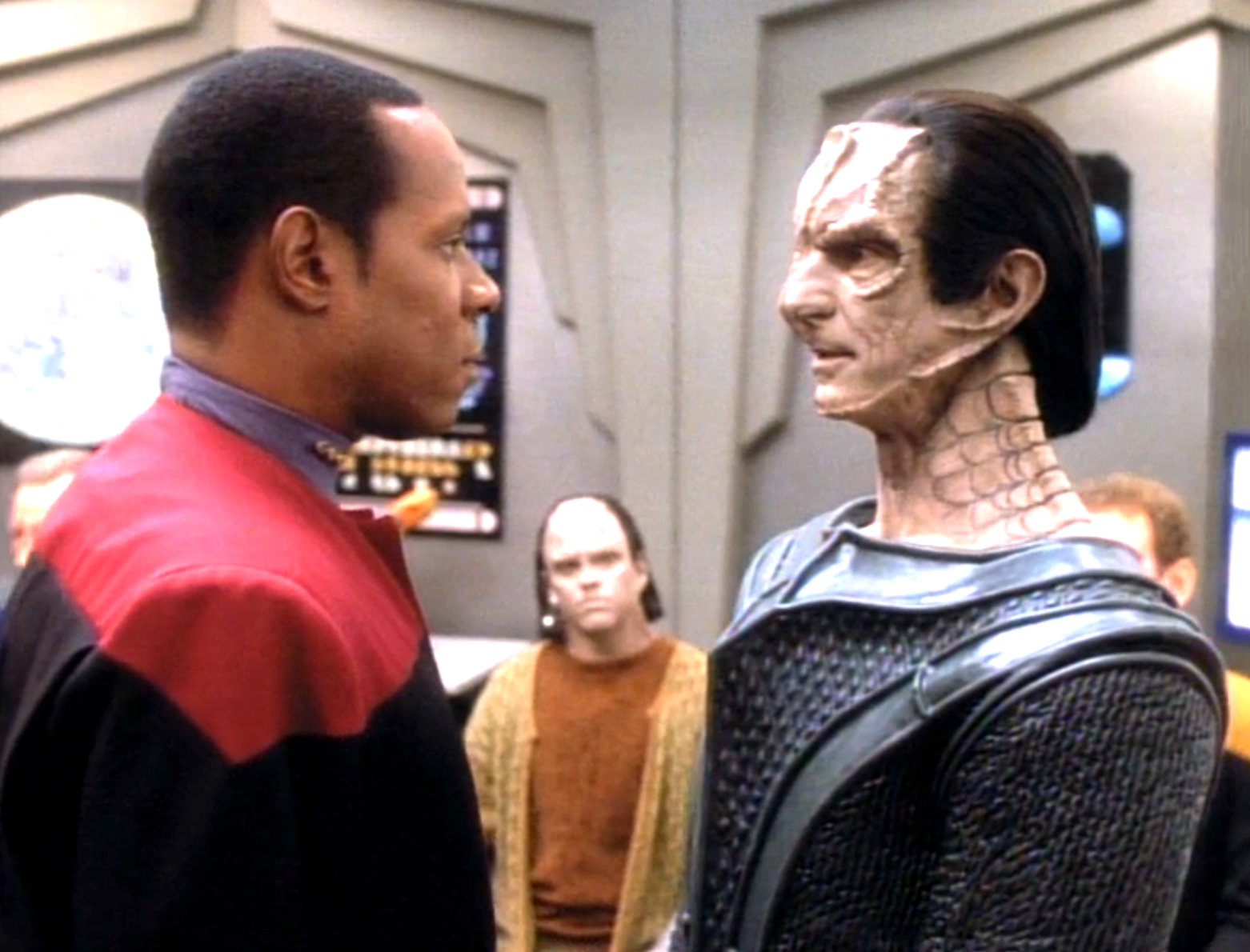 A Cardassian boy watching Sisko and Dukat argue