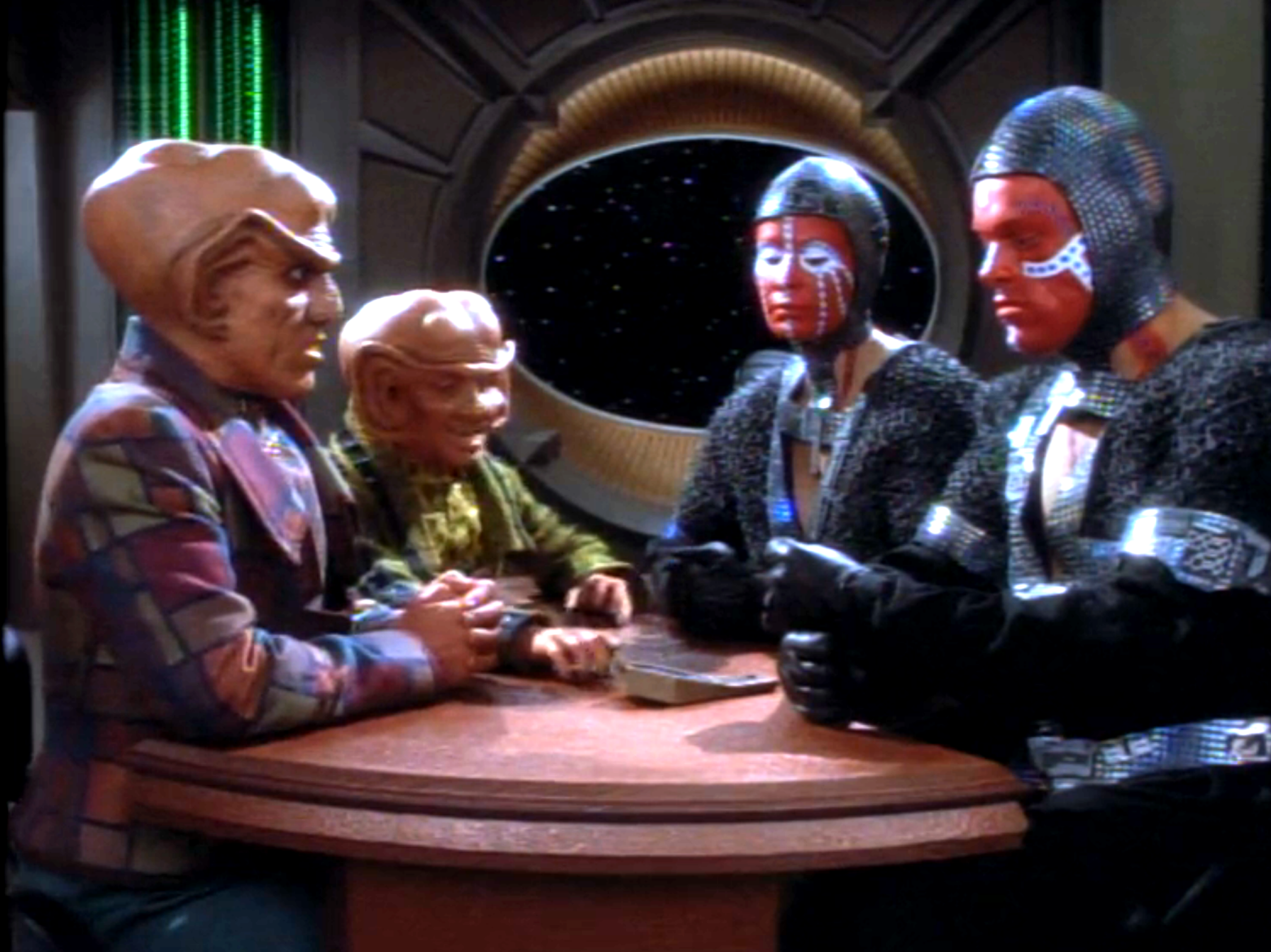 Quark and his assistant negotiating with two aliens