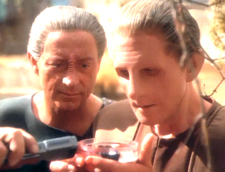 Odo and Dr. Mora analyzing an unknown sample