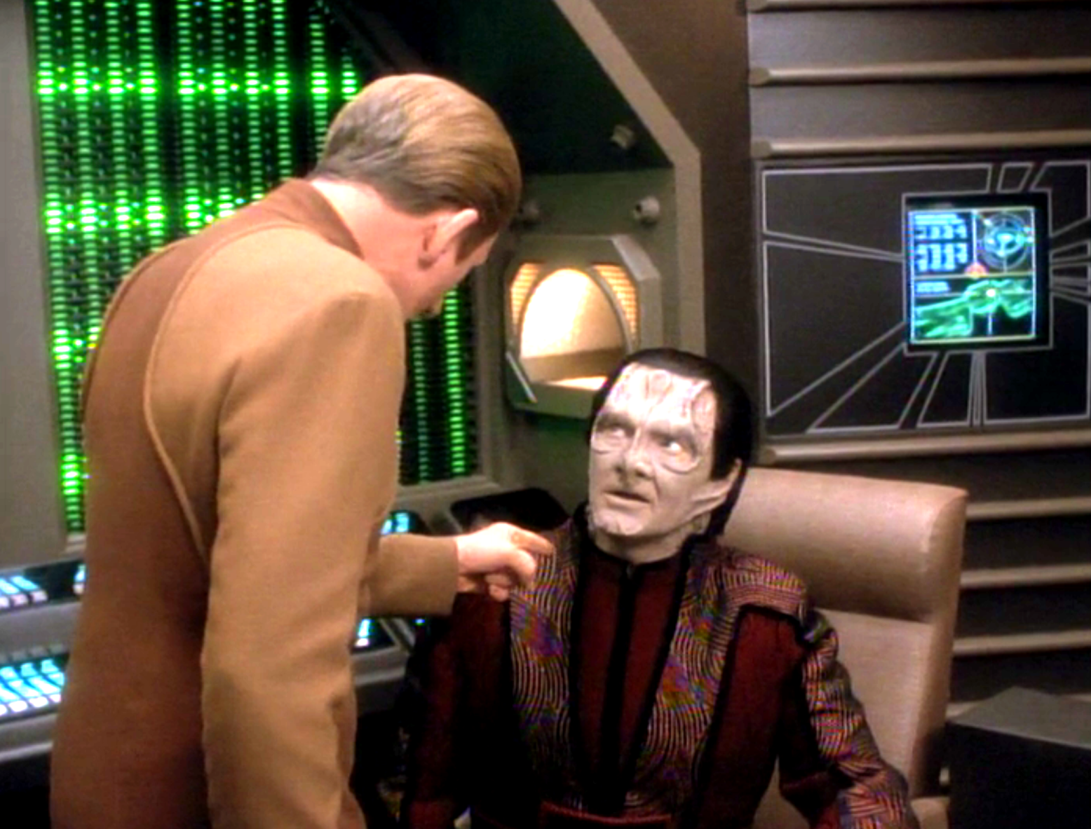 Odo pointing an accusatory finger at Garak