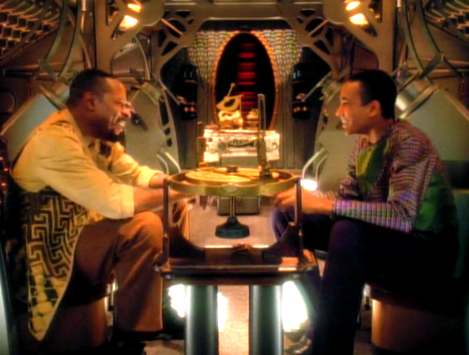 Benjamin and Jake Sisko talking and smiling in an ancient Bajoran space ship