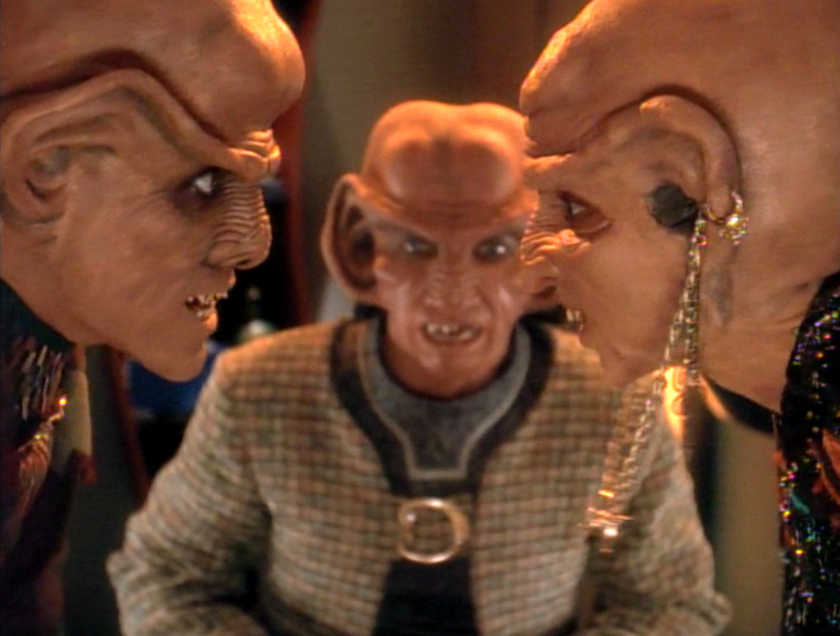 Quark and his mother arguing while Rom watches