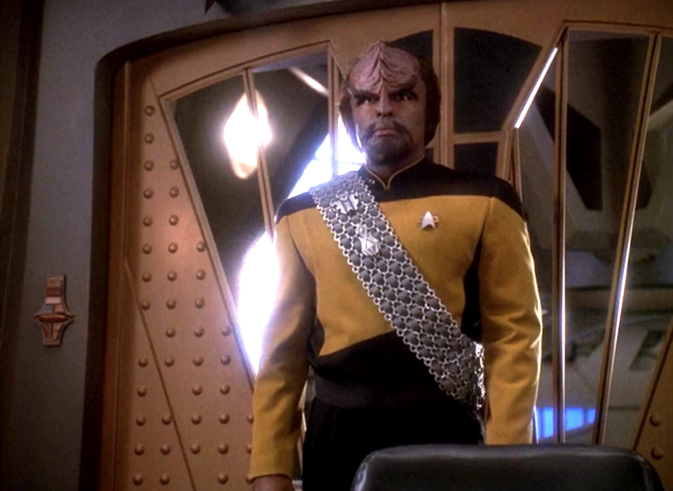 Lieutenant Commander Worf standing in Sisko's office