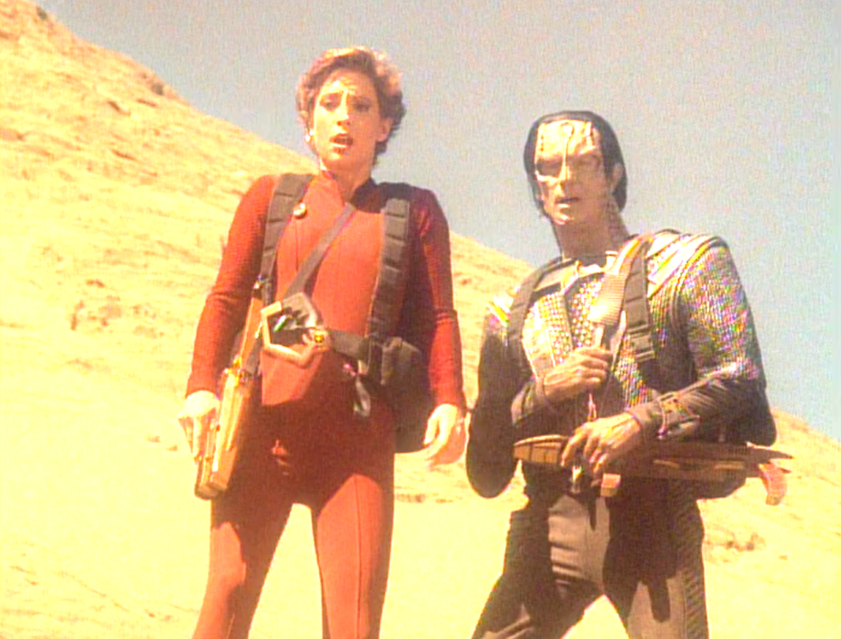 Kira and Dukat walking through a desert