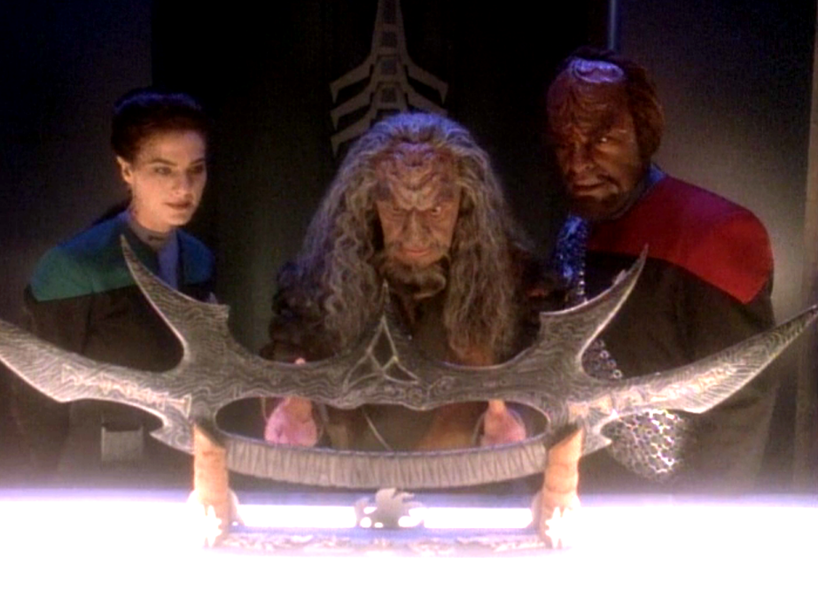 Dax, Worf, and Kor admiring an ornate bat'leth