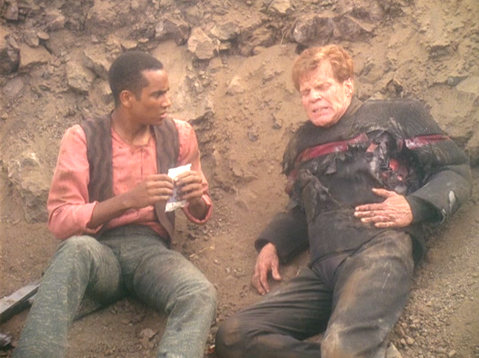 Jake Sisko talking to a gravely injured soldier lying in the dirt