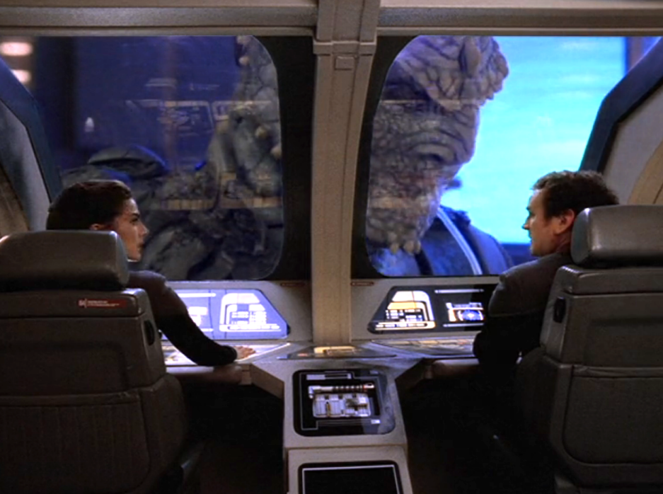 Dax and O'Brien in a runabout with a giant Jem'Hadar soldier outside the window