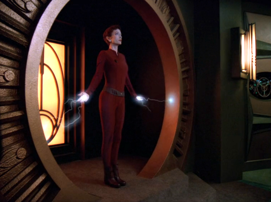 Kira standing in the threshold of the Bajoran shrine with sparks emitting from her hands