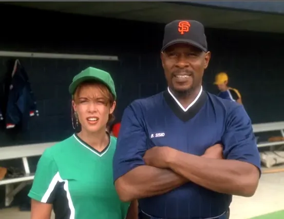 Sisko and Leeta wearing baseball uniforms