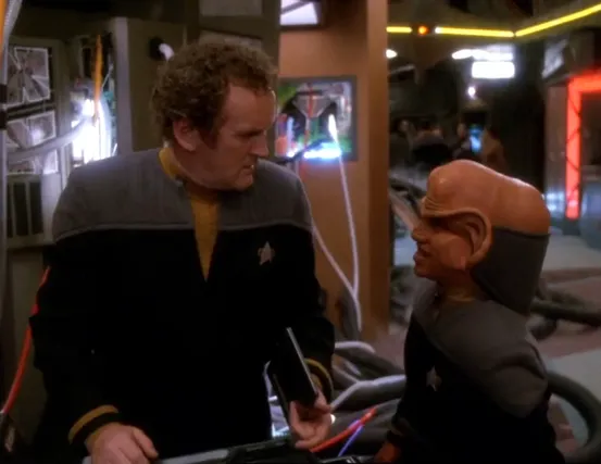 O'Brien and Nog talking while performing maintenance on the Promenade