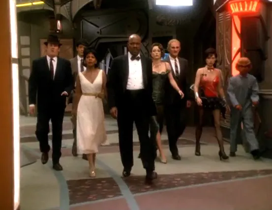 O'Brien, Bashir, Kasidy, Sisko, Kira, Odo, Ezri, and Nog strolling down the promenade wearing 1960's-style tuxedos, suits, and dresses