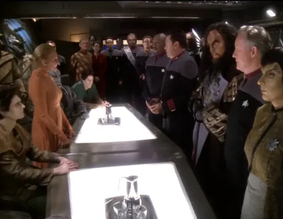 Humans, Bajorans, Klingons, and Romulans standing across a conference table from Founders, Vorta, and Jem'Hadar