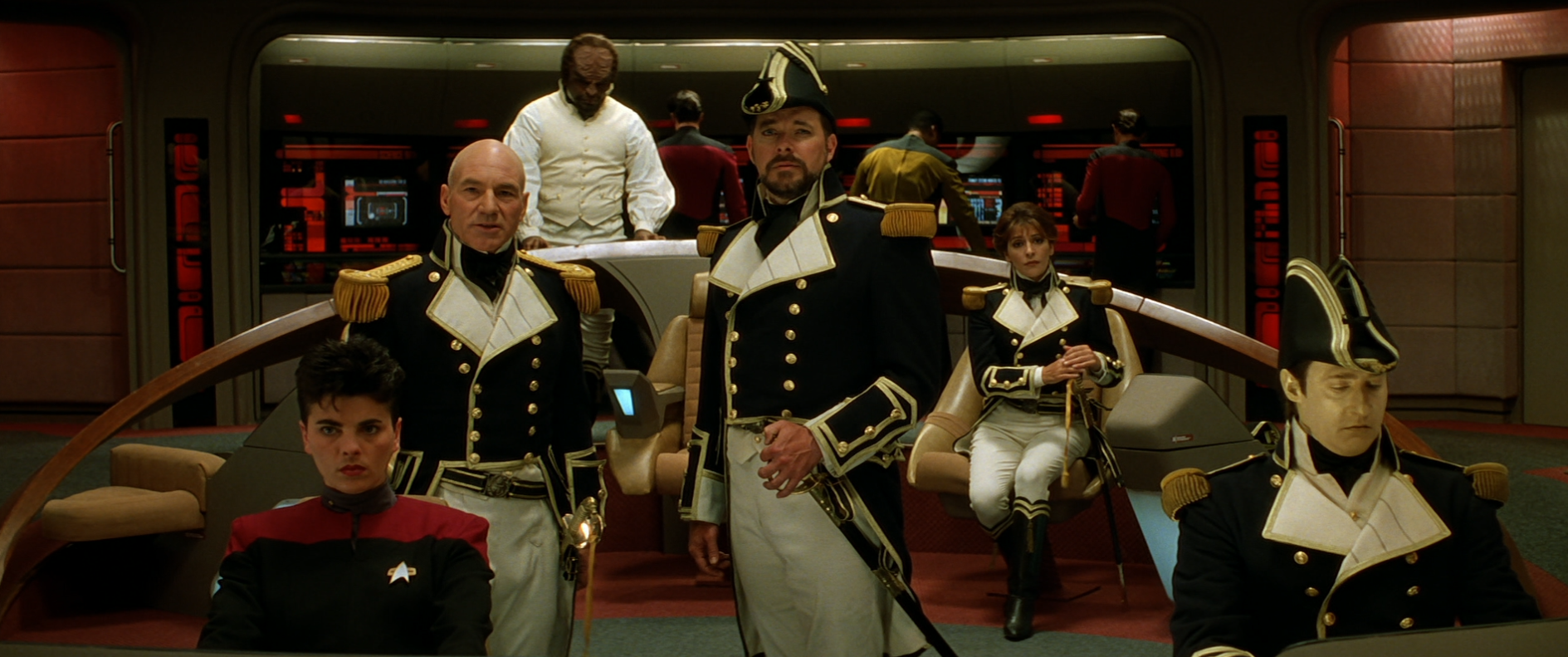 The bridge of the Enterprise-D, with Picard, Riker, Troi, Data, and Worf all wearing 19th-century British Navy uniforms