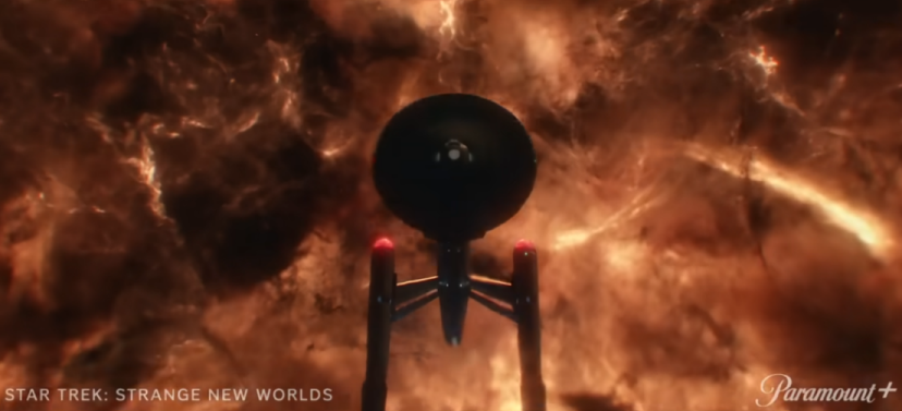 an image of several Starfleet cadets, with a youngf man in the foreground wearing a varsity jacket