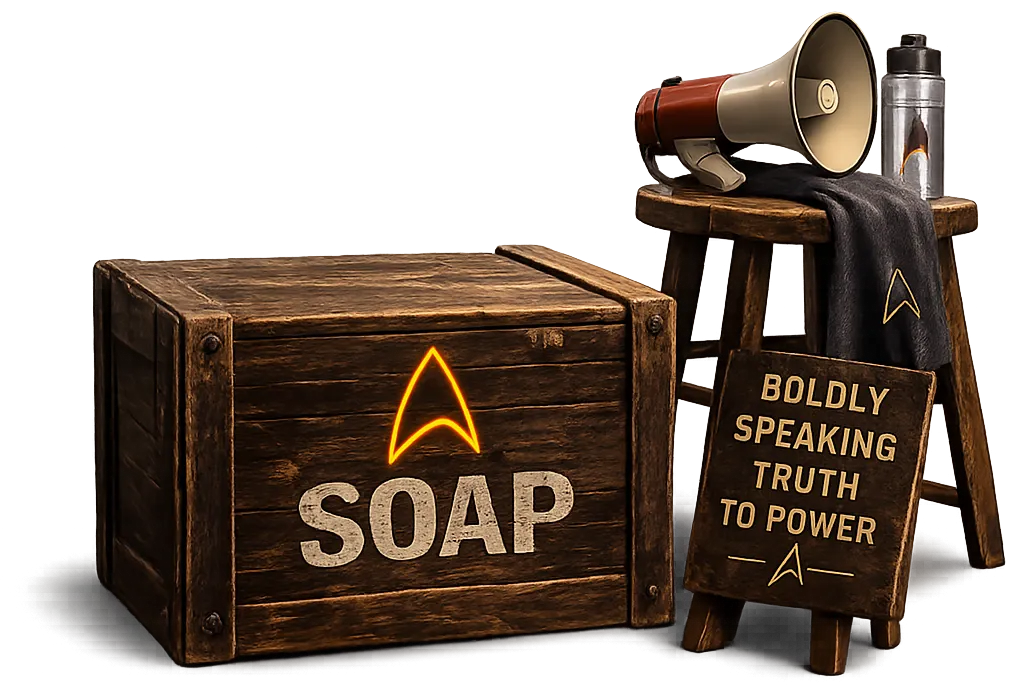 a Starfleet-branded soapbox; nearby is a megaphone, water bottle, towel, and a picket sign that reads 'Boldly speaking truth to power'