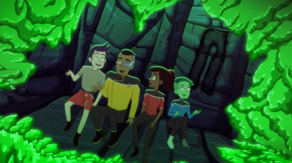 Boimler, Rutherford, Mariner, and Tendi telling stories in a cave as glowing green goo creeps up on them