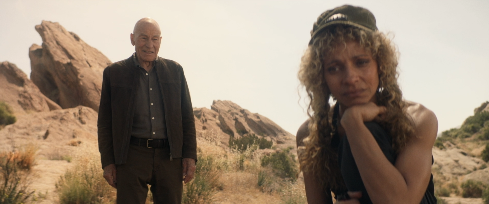 Picard speaking to a dejected-looking Raffi at the Vasquez Rocks