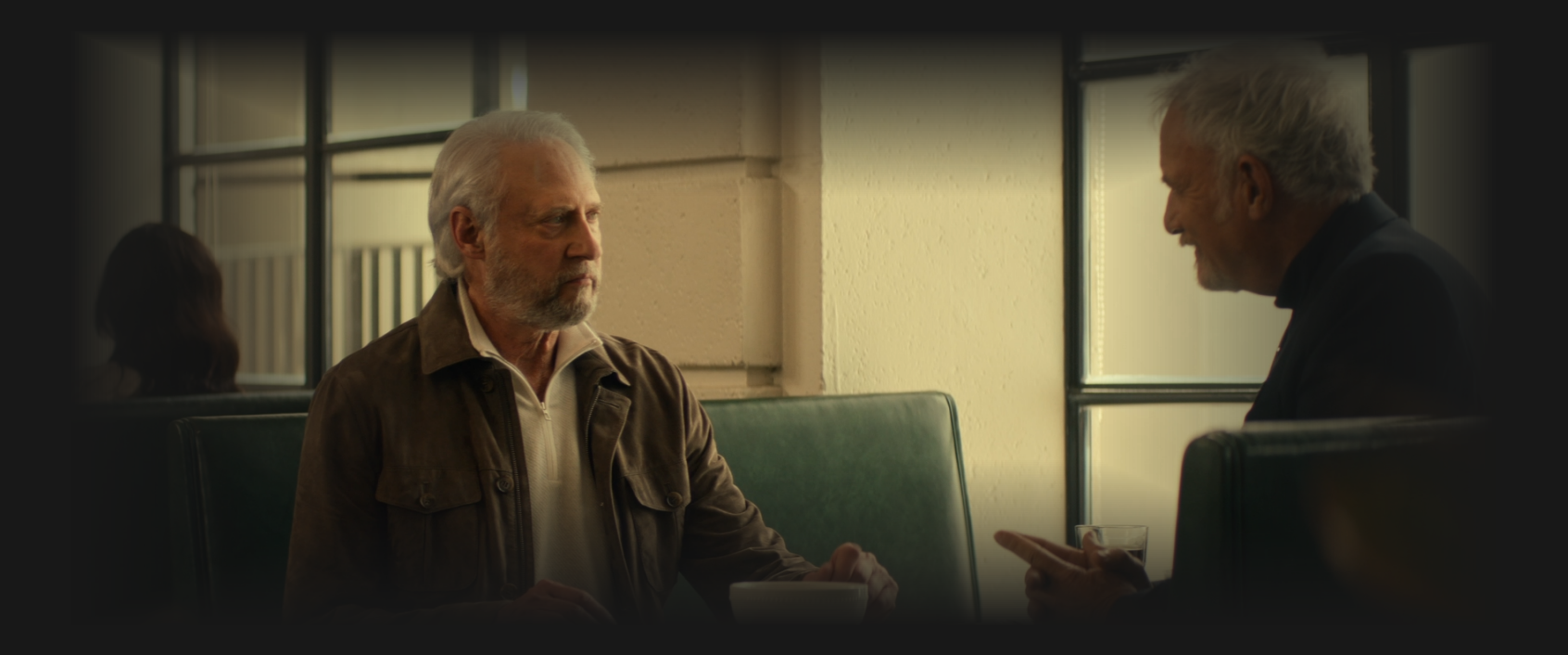 Q and Soong having a conversation in a diner booth