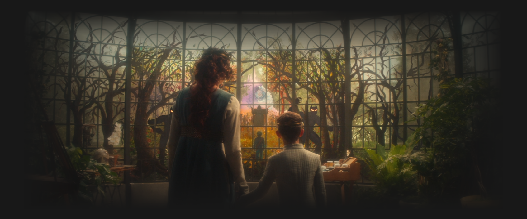 A young Picard and his mother holding hands in the solarium