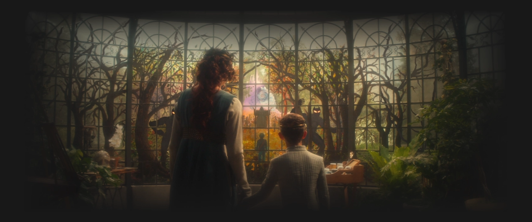 A young Picard and his mother holding hands in the solarium