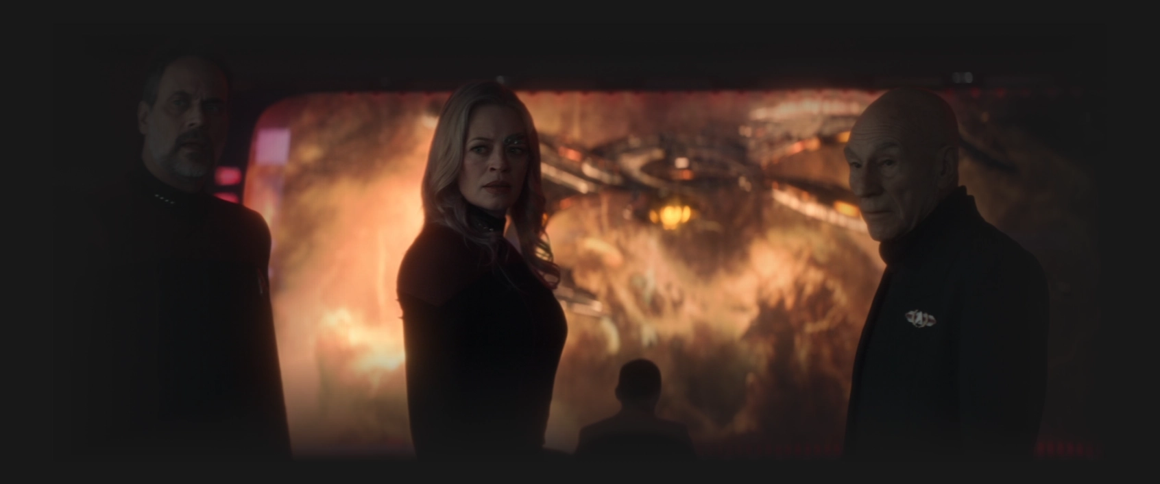 Shaw, Seven, and Picard looking concerned as the Shrike approaches on the viewscreen behind them