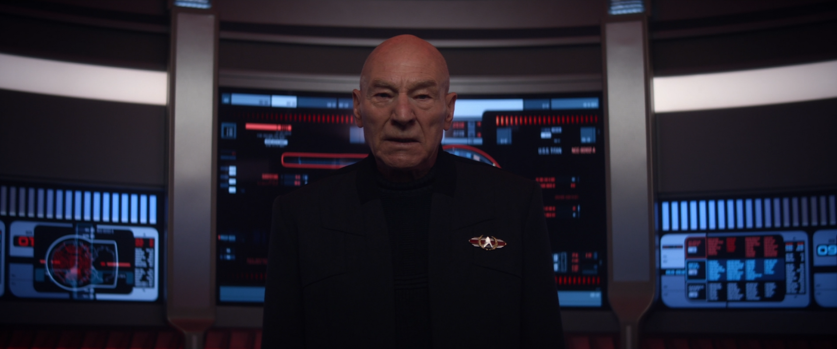 Picard looking concerned as he waits for the turbolift to reach its destination