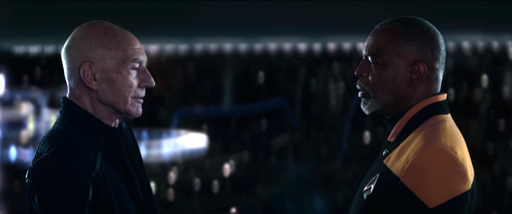 Picard and La Forge having a conversation on the bridge