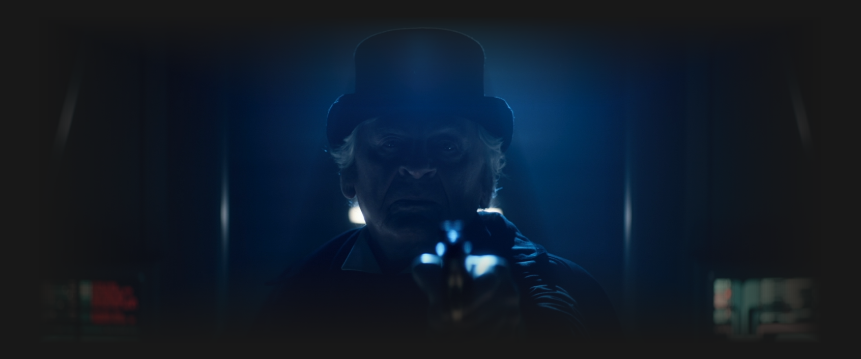 Moriarty, in a top hat, aiming a revolver straight ahead of him