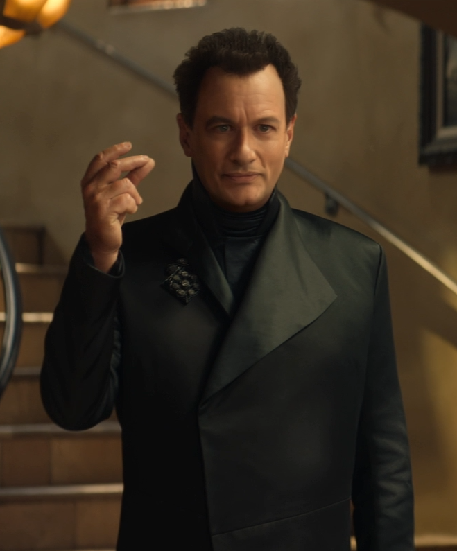 A younger-looking Q about to snap his fingers