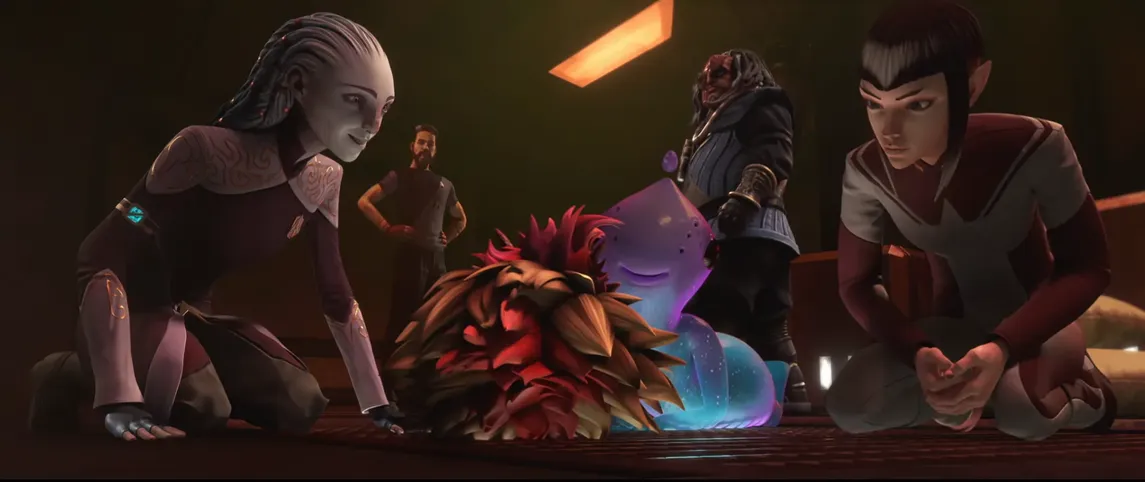 Gwyn, Maj'el, and Murf doting over a tribble-brikar hybrid