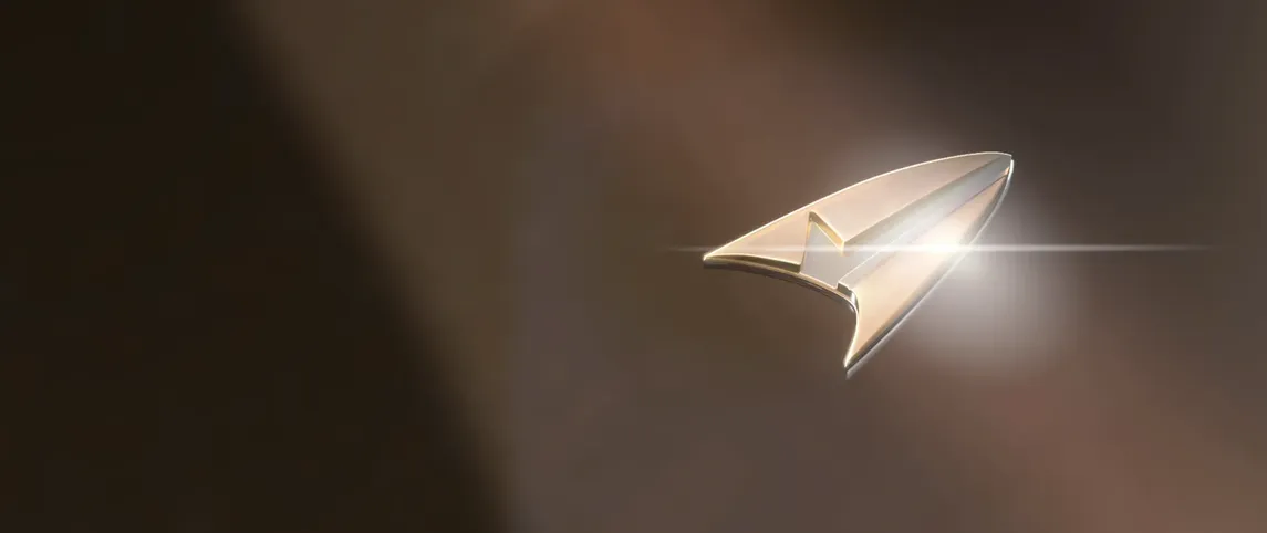 A combadge from the Protostar with a glint of light reflecting off of it